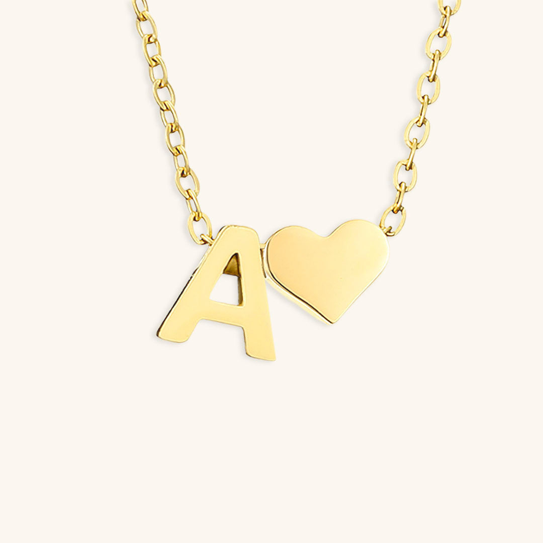 navnesmykke med initialen Ria | 18k Gull