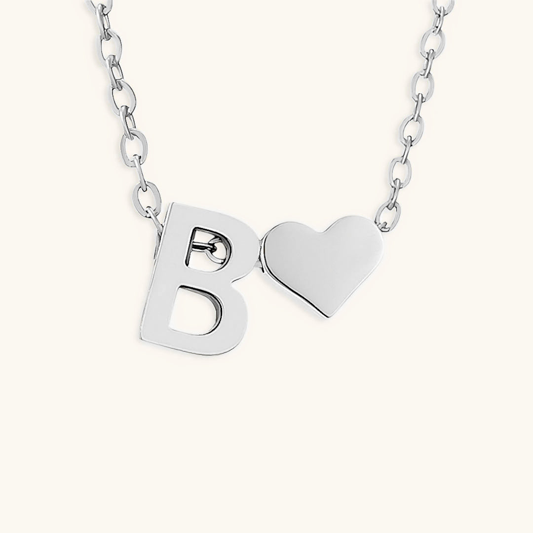navnesmykke med initialen Ria | 18k Gull