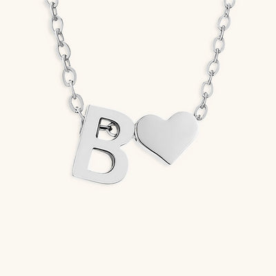 navnesmykke med initialen Ria | 18k Gull