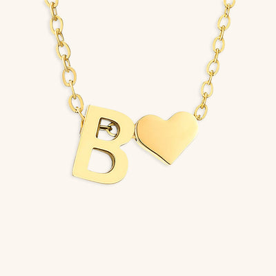 navnesmykke med initialen Ria | 18k Gull