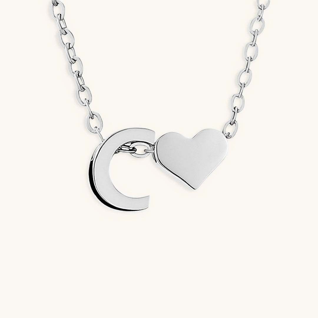 navnesmykke med initialen Ria | 18k Gull