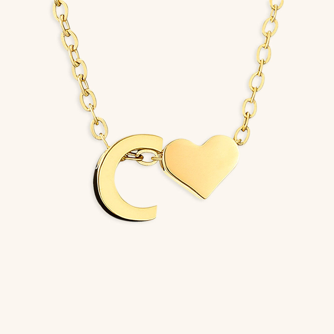 navnesmykke med initialen Ria | 18k Gull