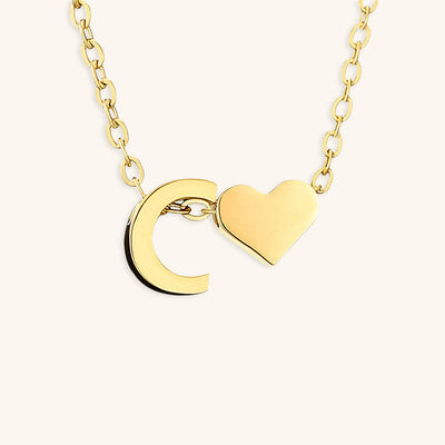 navnesmykke med initialen Ria | 18k Gull