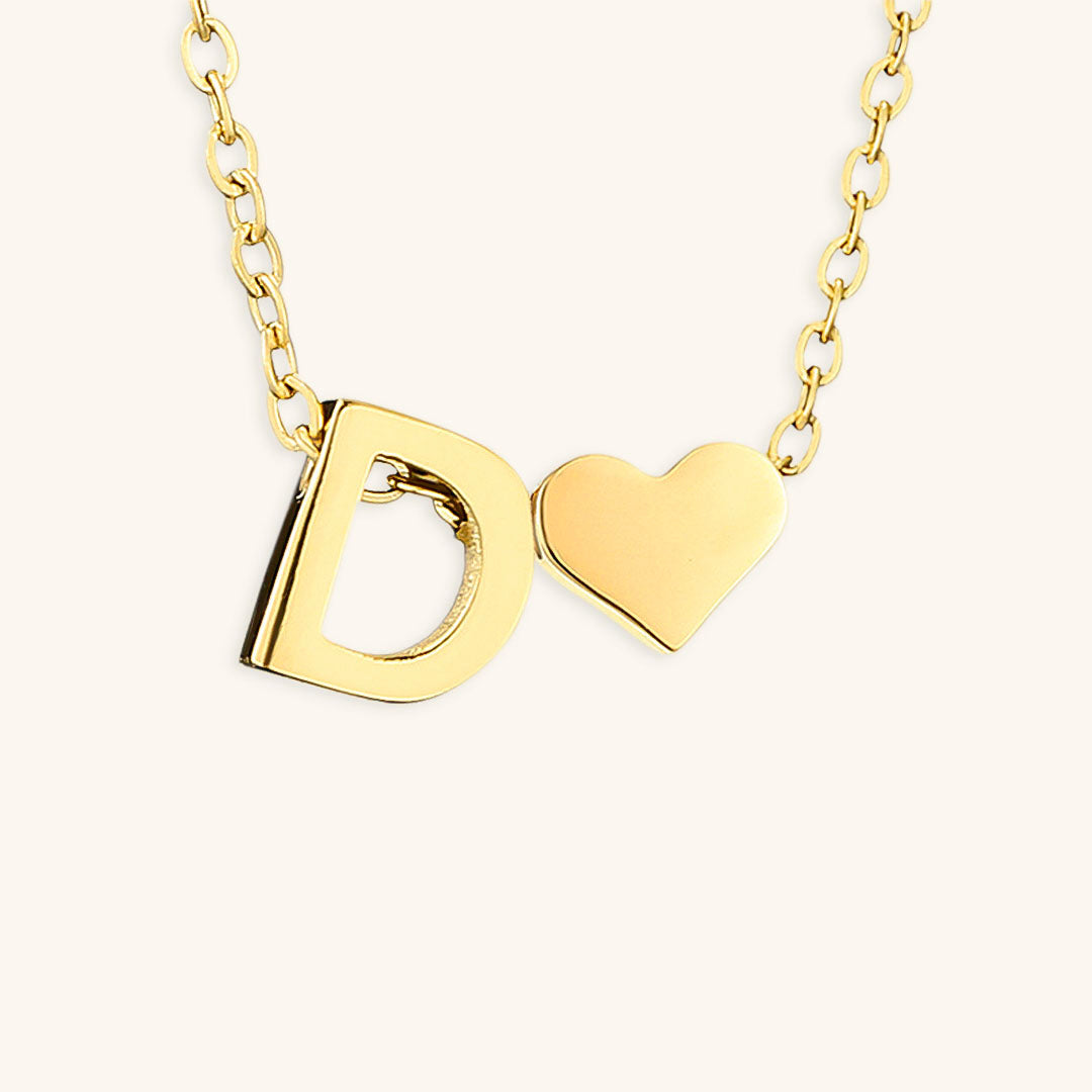 navnesmykke med initialen Ria | 18k Gull