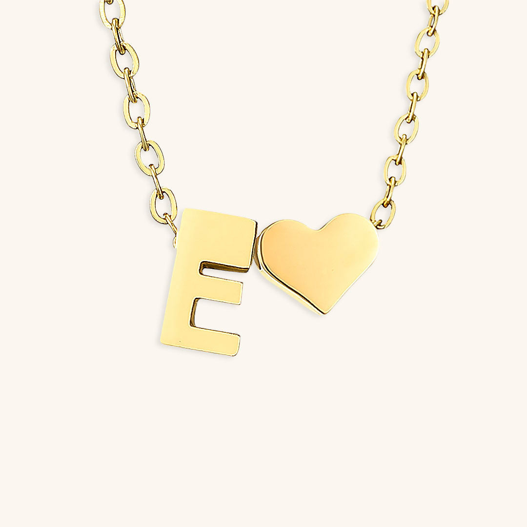 navnesmykke med initialen Ria | 18k Gull