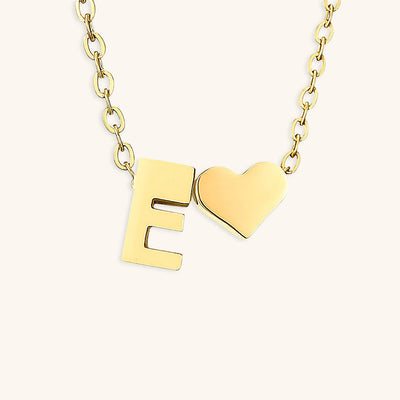 navnesmykke med initialen Ria | 18k Gull