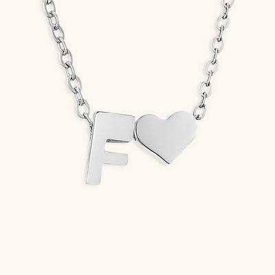 navnesmykke med initialen Ria | 18k Gull
