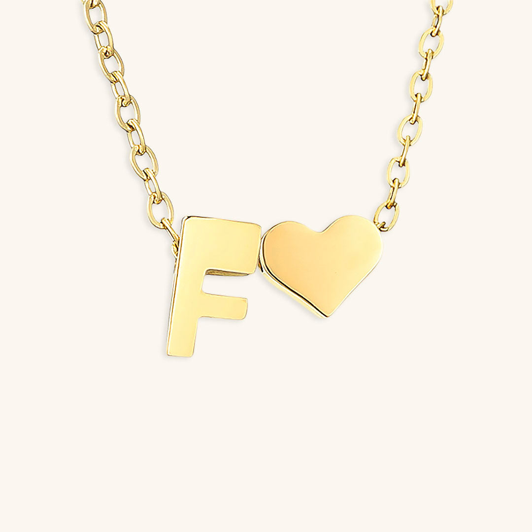 navnesmykke med initialen Ria | 18k Gull