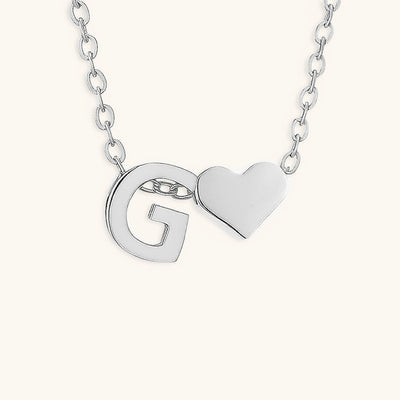 navnesmykke med initialen Ria | 18k Gull