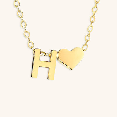navnesmykke med initialen Ria | 18k Gull