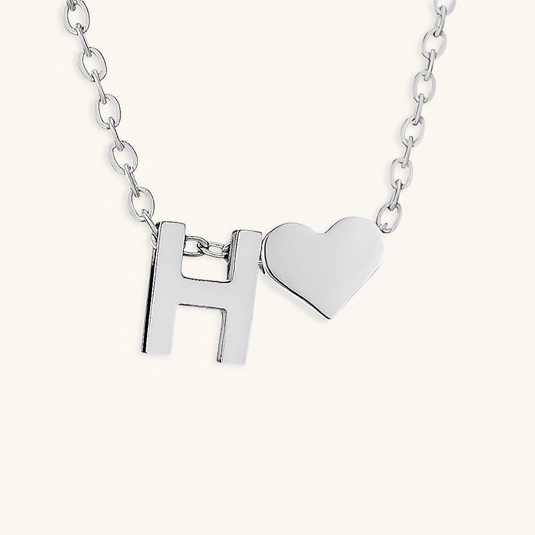 navnesmykke med initialen Ria | 18k Gull