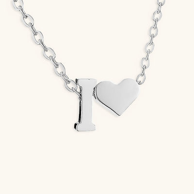 navnesmykke med initialen Ria | 18k Gull