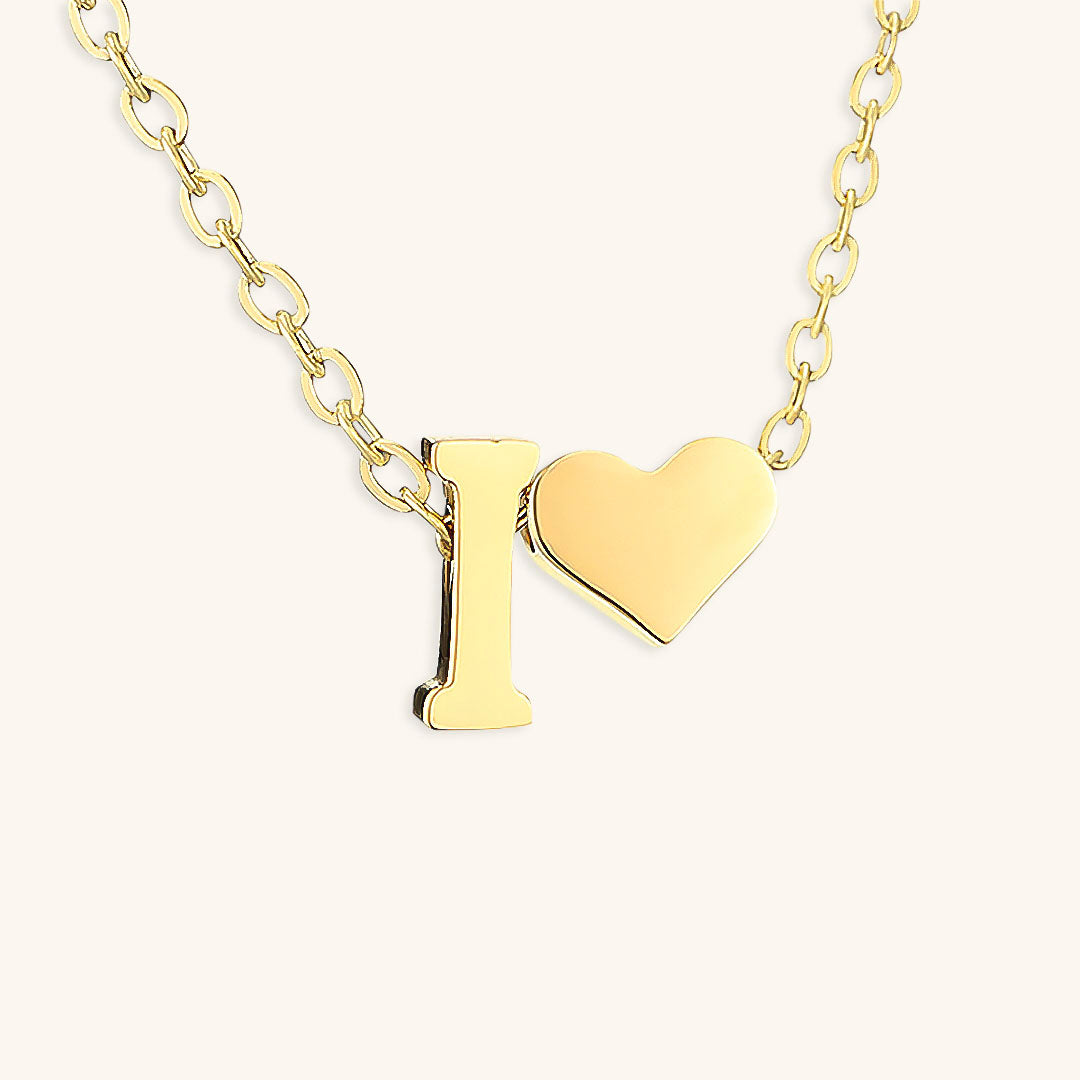 navnesmykke med initialen Ria | 18k Gull