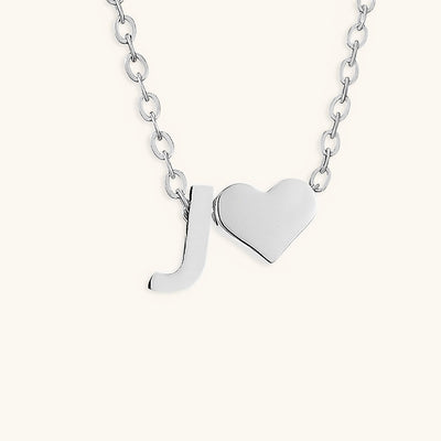 navnesmykke med initialen Ria | 18k Gull