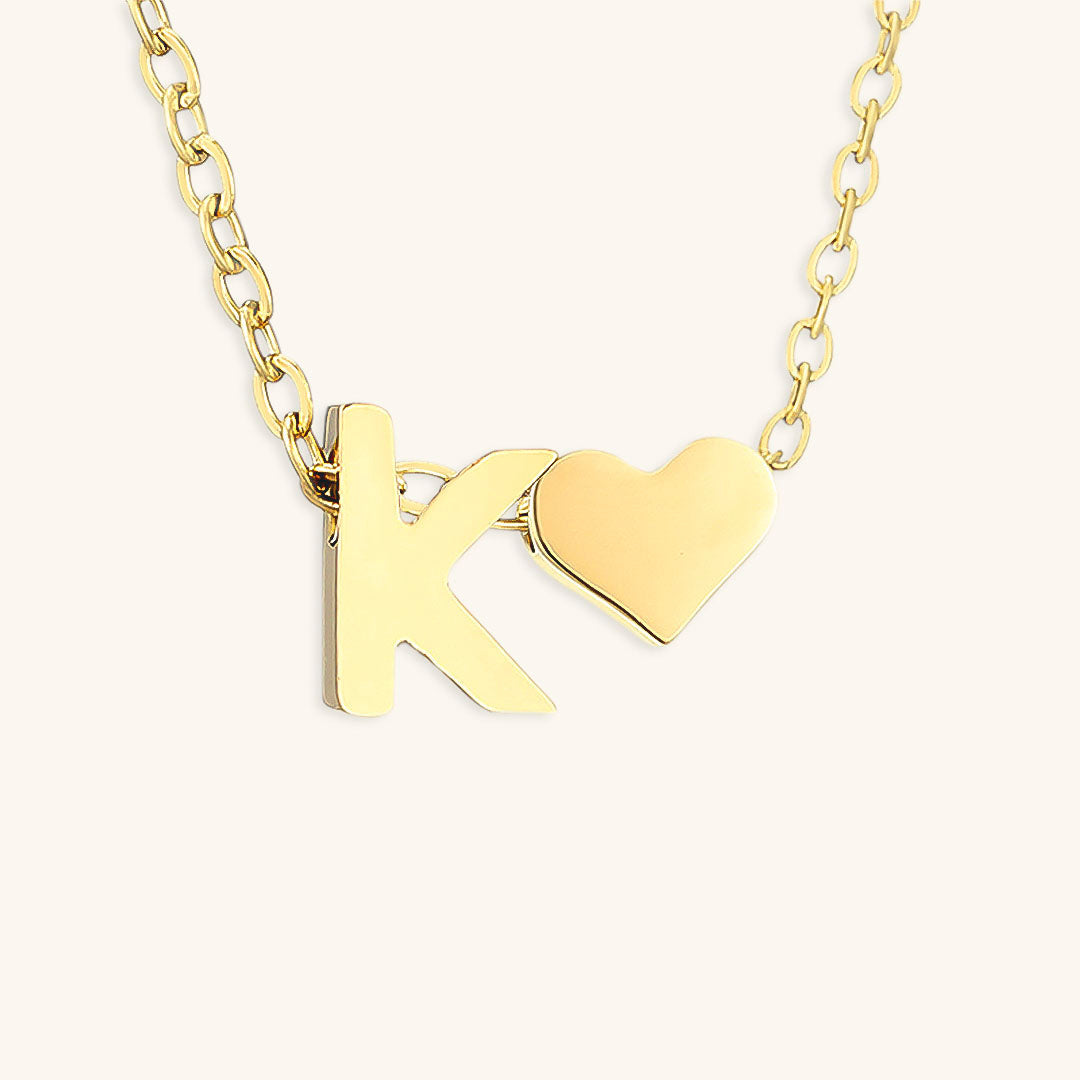 navnesmykke med initialen Ria | 18k Gull