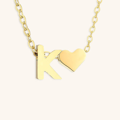 navnesmykke med initialen Ria | 18k Gull
