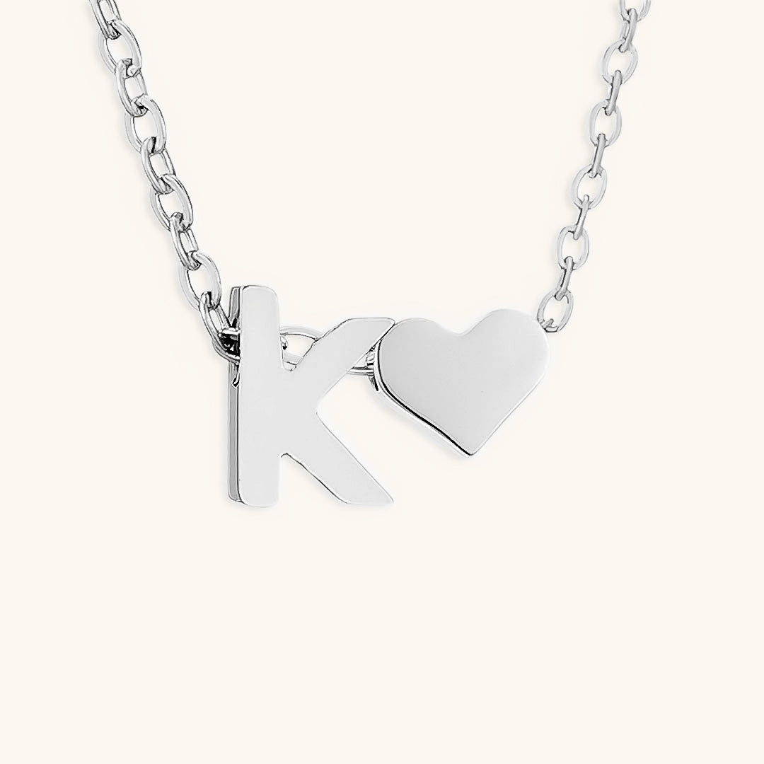 navnesmykke med initialen Ria | 18k Gull