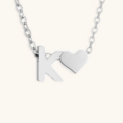 navnesmykke med initialen Ria | 18k Gull