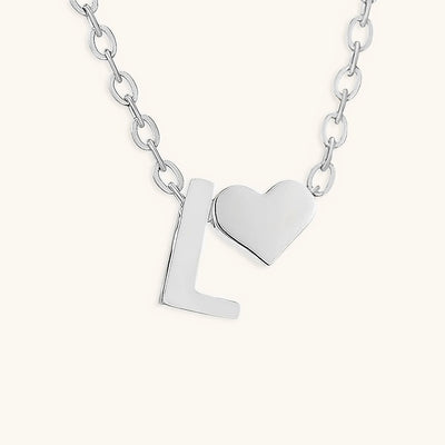 navnesmykke med initialen Ria | 18k Gull