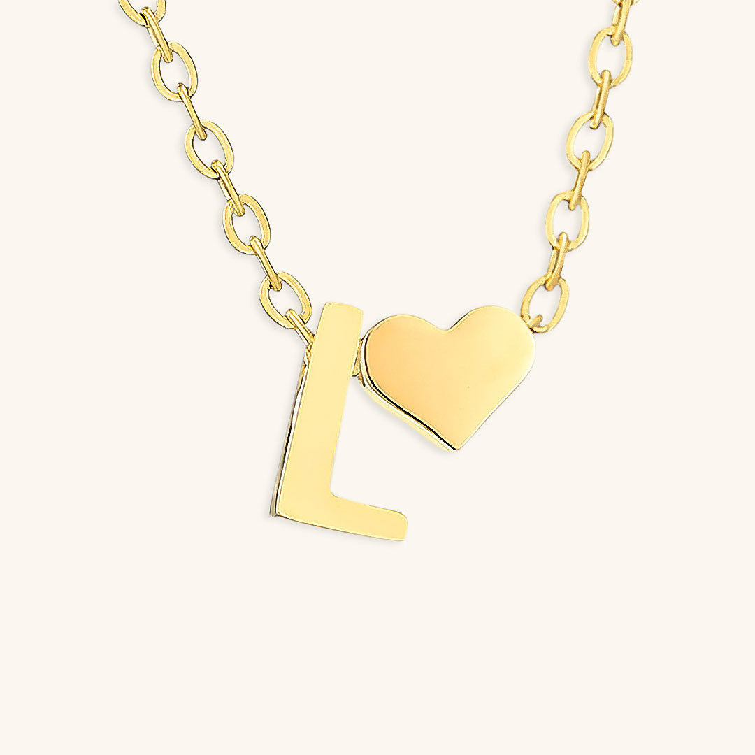 navnesmykke med initialen Ria | 18k Gull