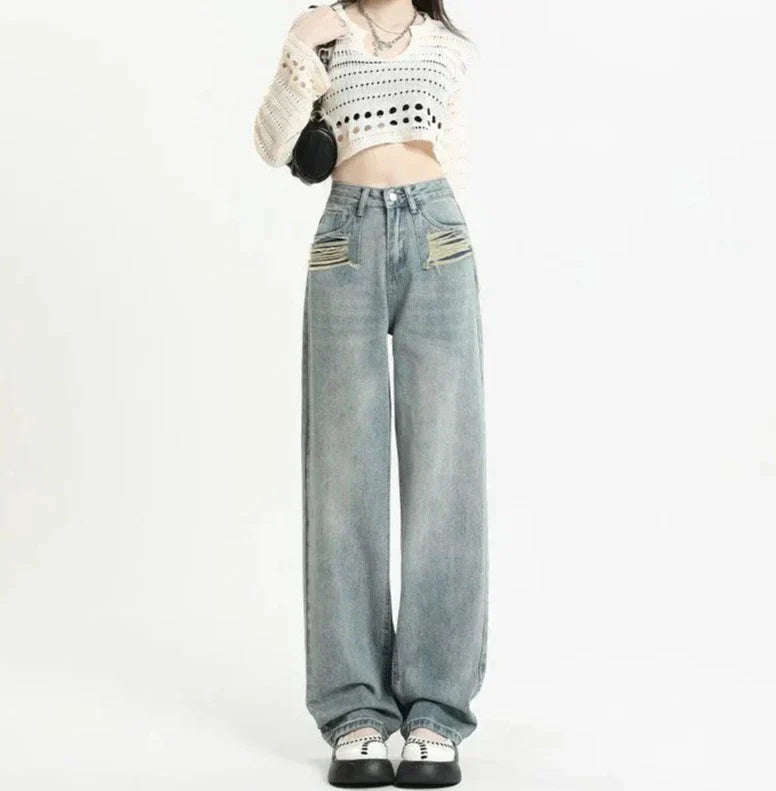 Høyt midjede jeans med slitte lommer