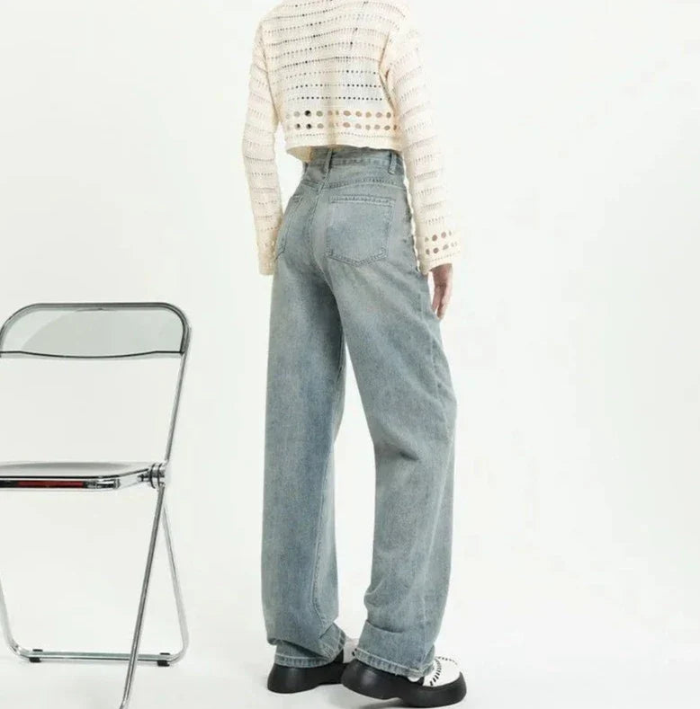 Høyt midjede jeans med slitte lommer