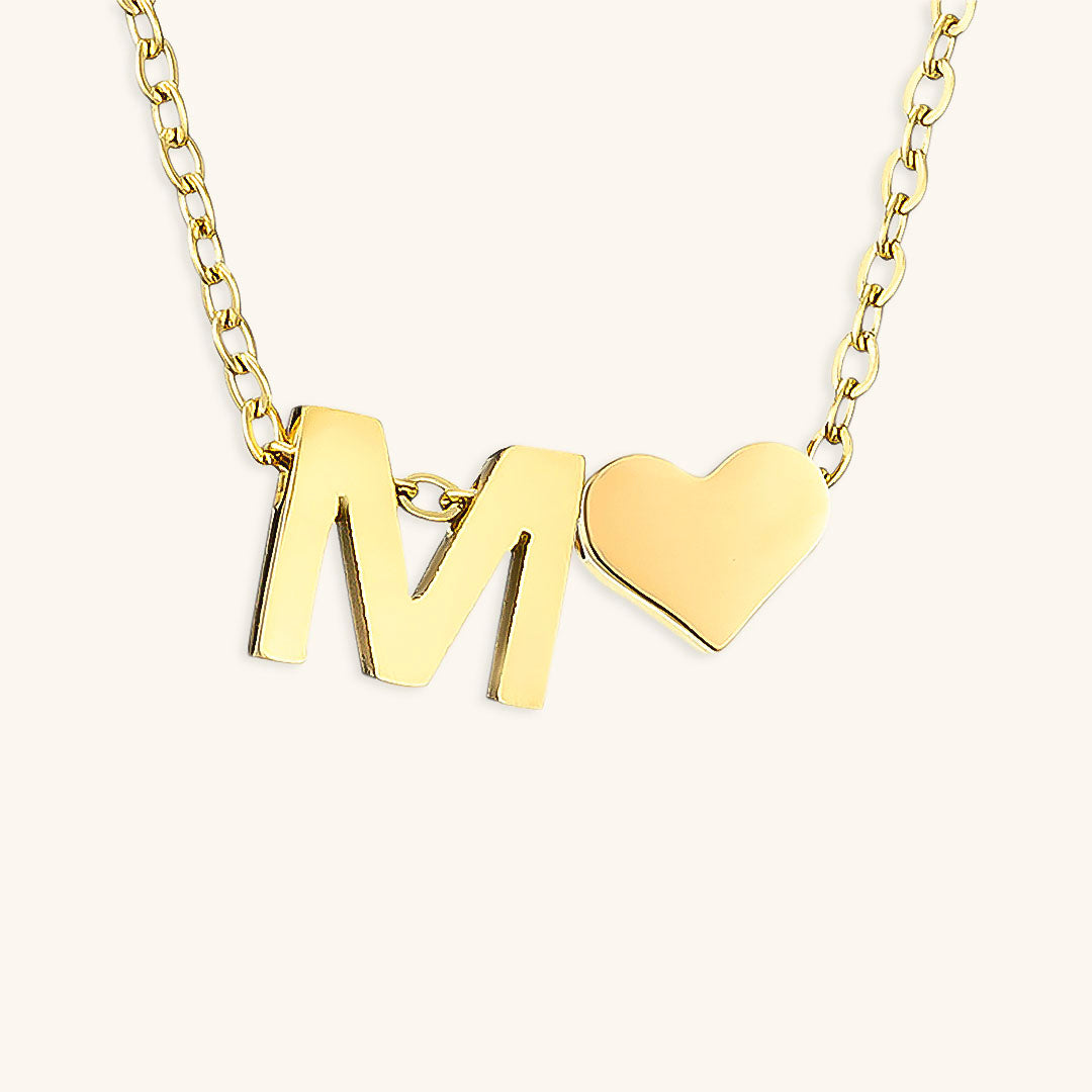 navnesmykke med initialen Ria | 18k Gull