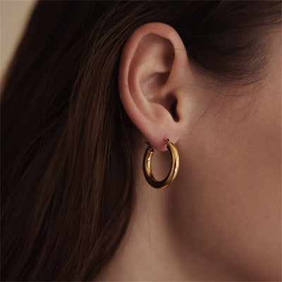 Elegante brede runde øreringer | 18k gull