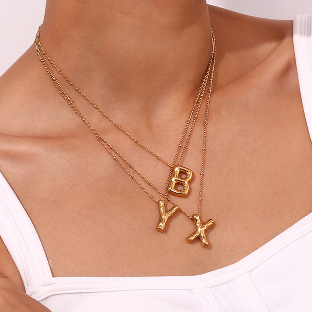 Neseørering med initialer i bobleform | Gull 18k