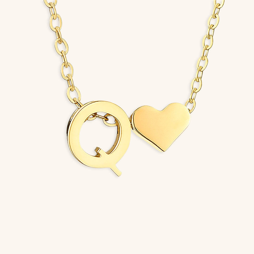 navnesmykke med initialen Ria | 18k Gull