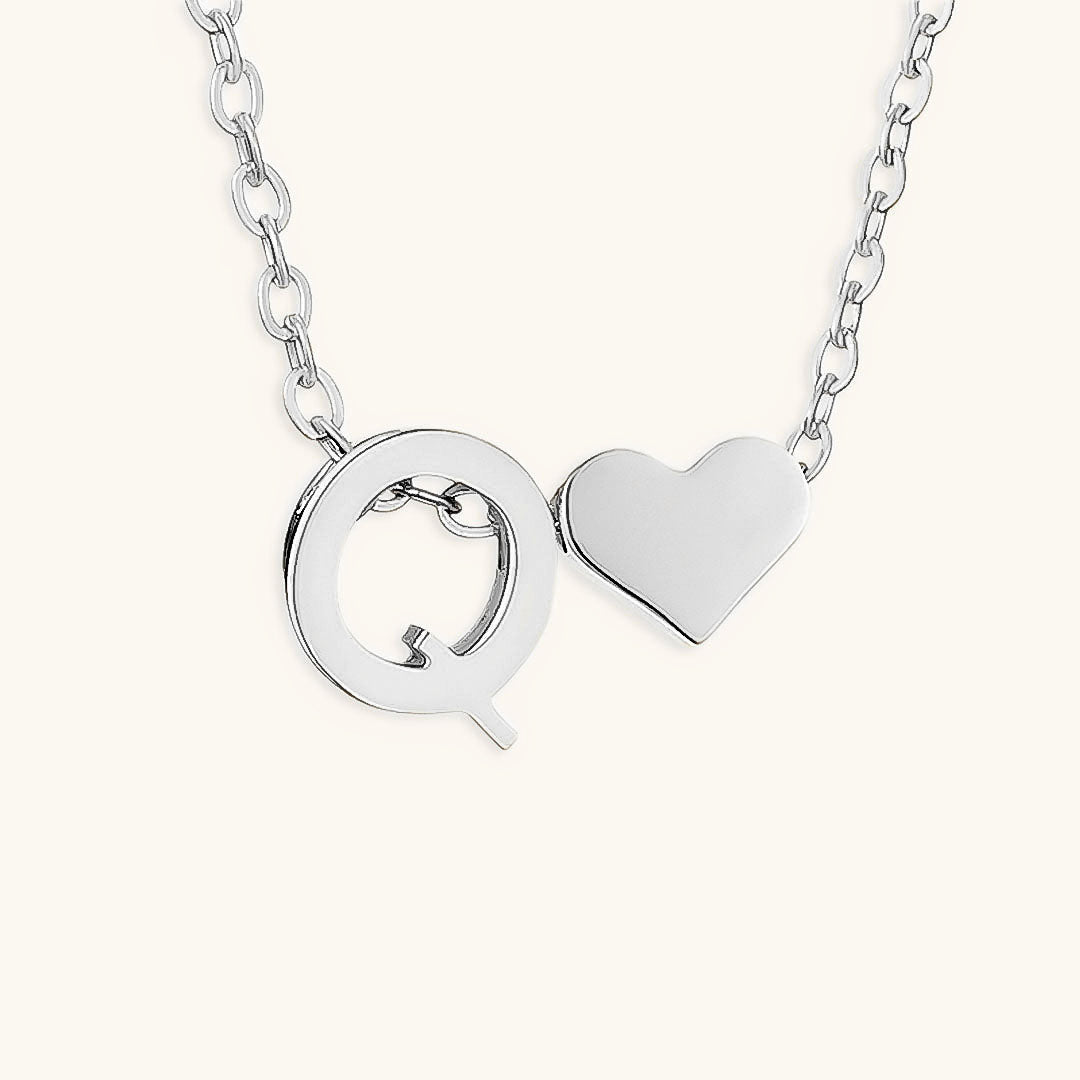 navnesmykke med initialen Ria | 18k Gull