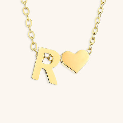 navnesmykke med initialen Ria | 18k Gull