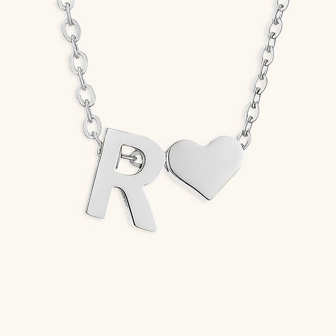 navnesmykke med initialen Ria | 18k Gull