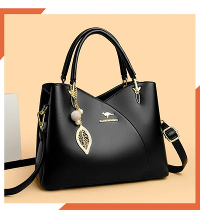Felina™ – Elegant svart skulderveske med stilige anheng