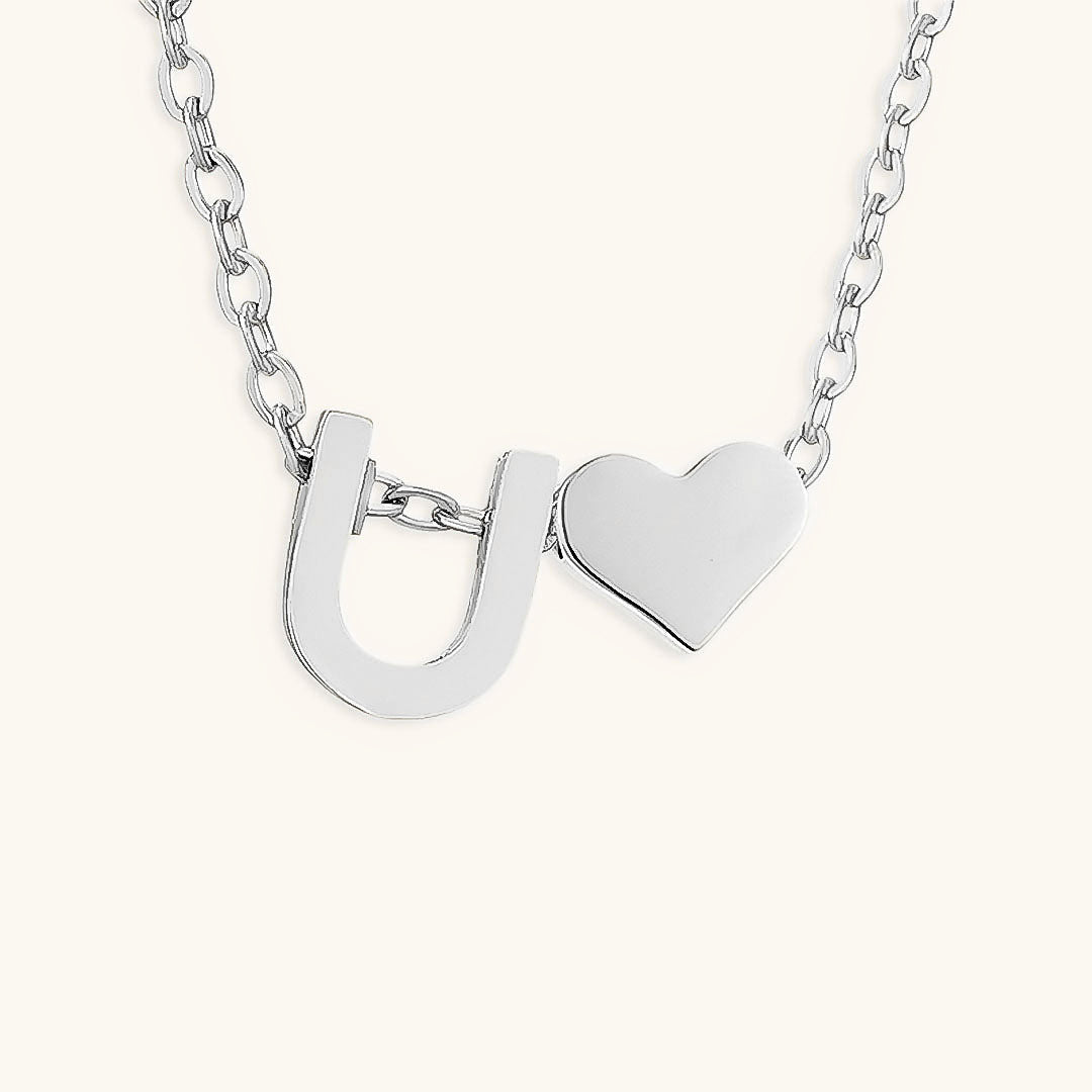 navnesmykke med initialen Ria | 18k Gull