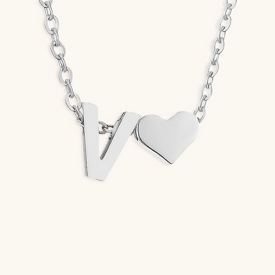 navnesmykke med initialen Ria | 18k Gull