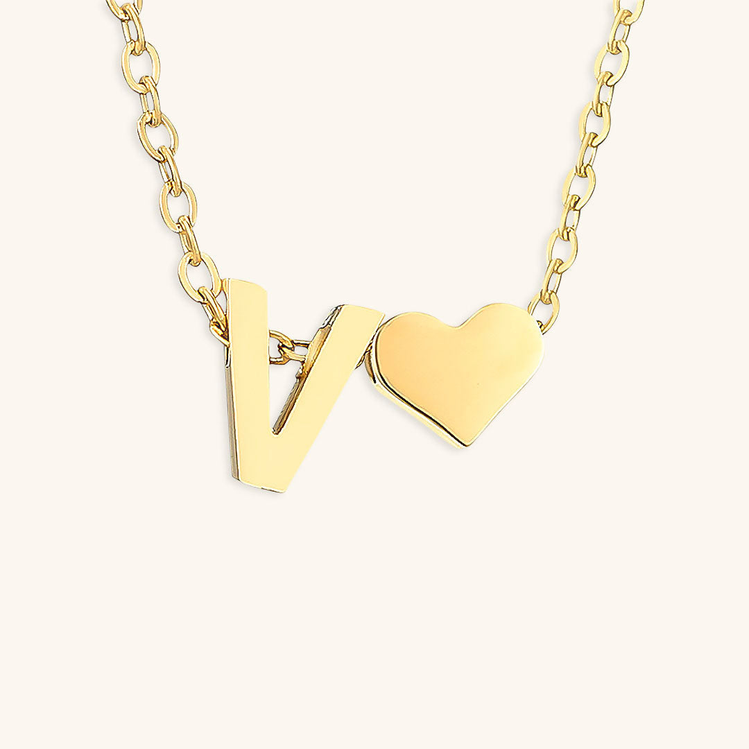 navnesmykke med initialen Ria | 18k Gull