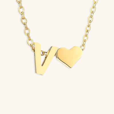 navnesmykke med initialen Ria | 18k Gull