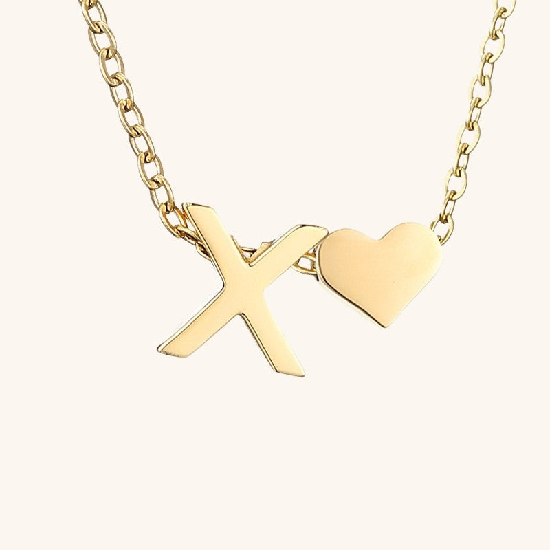 navnesmykke med initialen Ria | 18k Gull