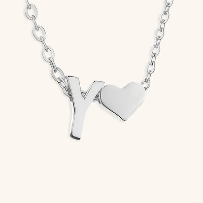 navnesmykke med initialen Ria | 18k Gull