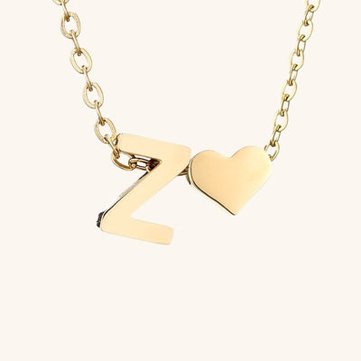 navnesmykke med initialen Ria | 18k Gull
