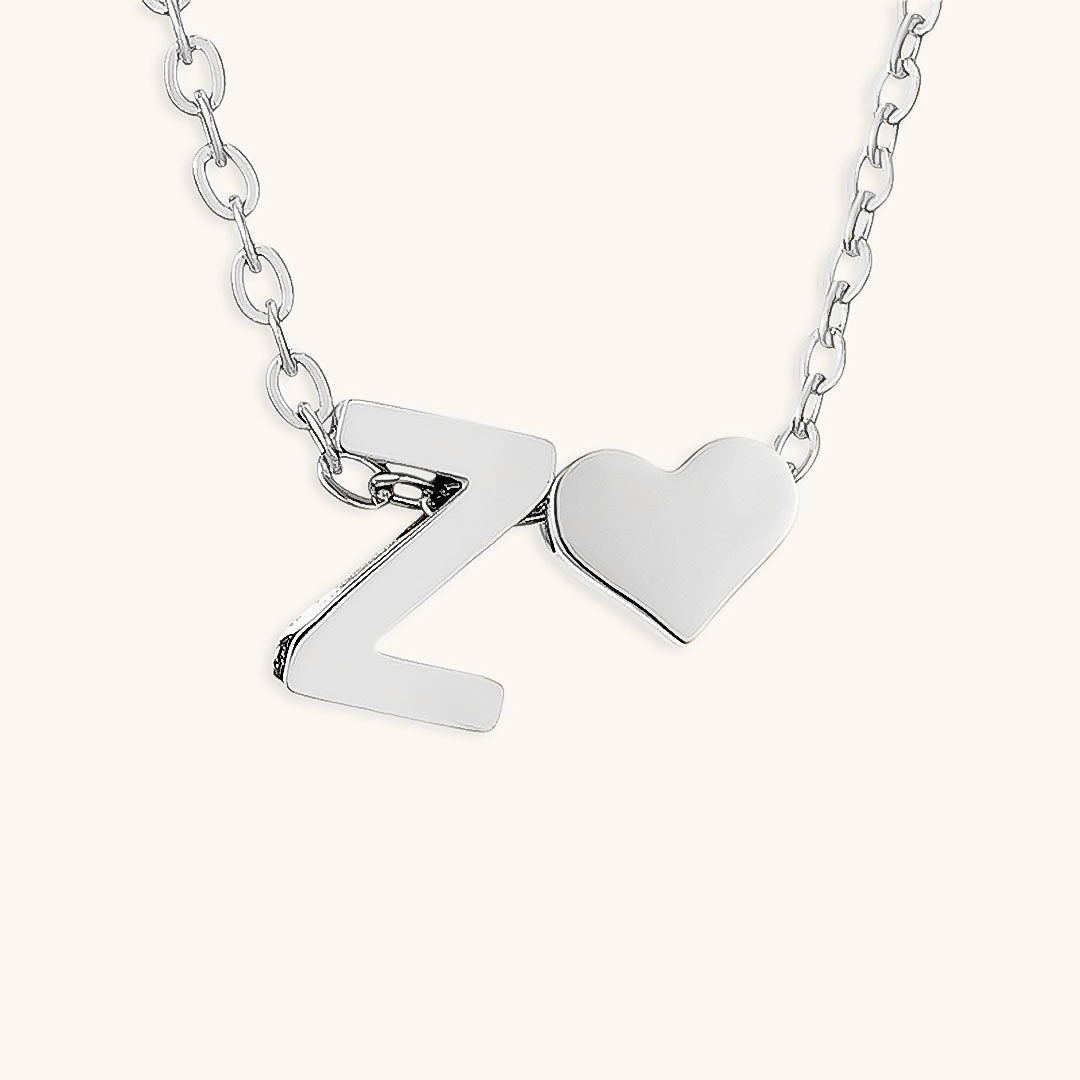 navnesmykke med initialen Ria | 18k Gull