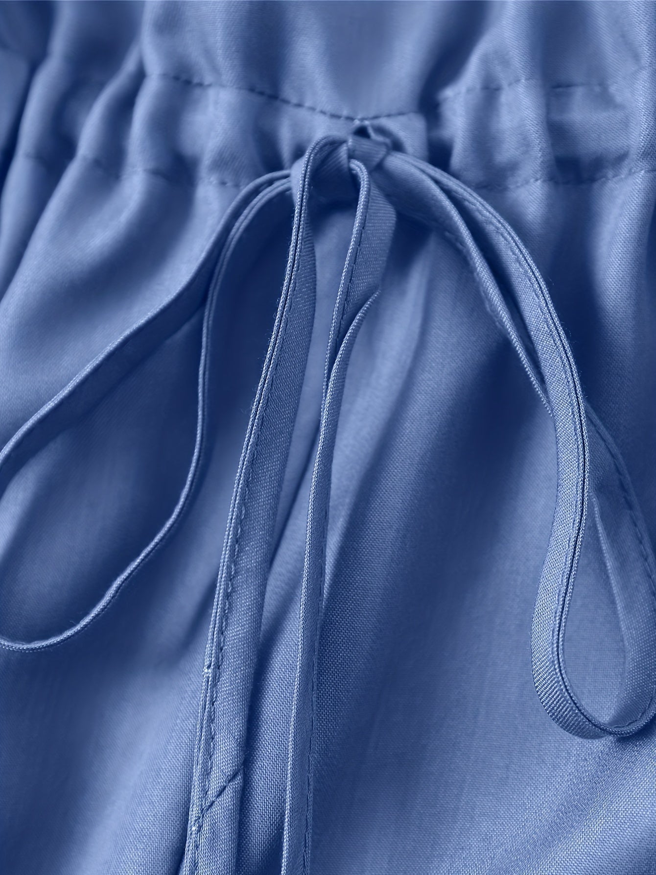 Denim jumpsuit med glidelås foran og belte i midjen